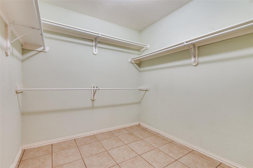 8530 Quicksilver Drive Dallas, TX 75249 - Photo 17 of 25 a view of a room with racks on the wall
