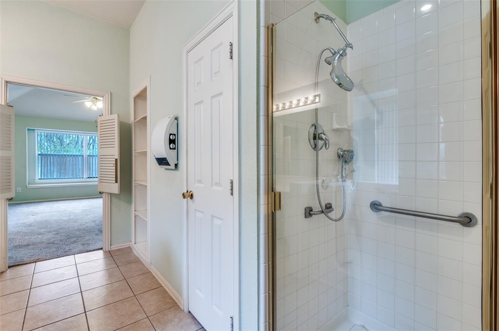 8530 Quicksilver Drive Dallas, TX 75249 - Photo 18 of 25 a bathroom with a shower