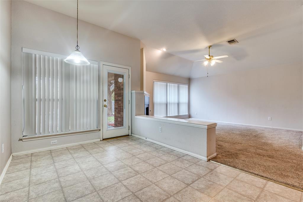 8530 Quicksilver Drive Dallas, TX 75249 - Photo 4 of 25 a view of an empty room with a window