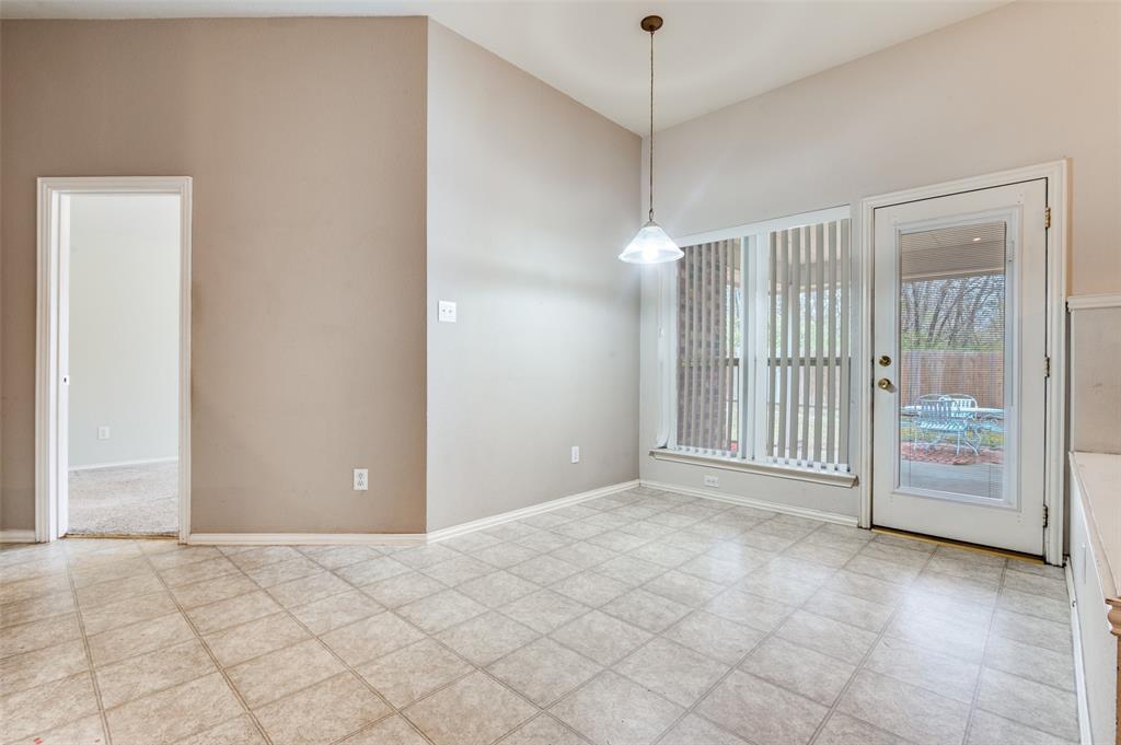 8530 Quicksilver Drive Dallas, TX 75249 - Photo 5 of 25 a view of an empty room with a window