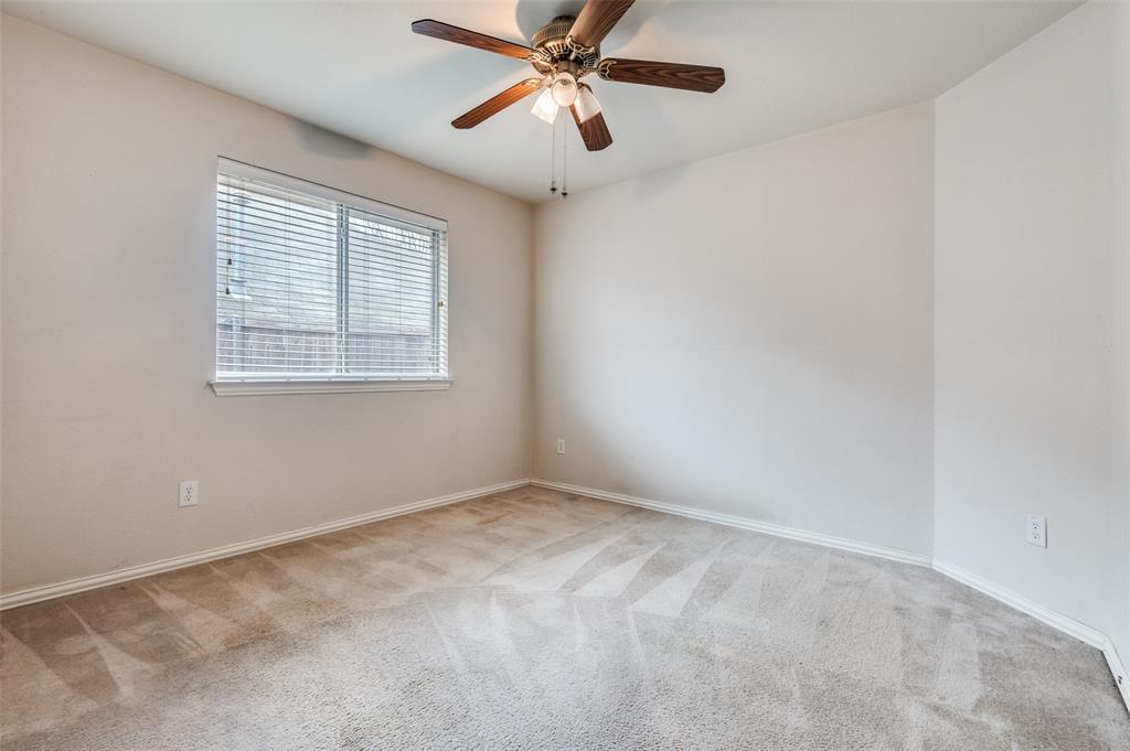 8530 Quicksilver Drive Dallas, TX 75249 - Photo 9 of 25 a view of an empty room with a window