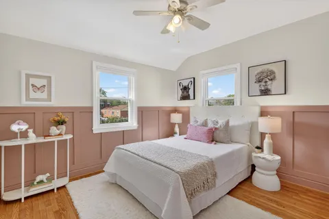 a bedroom with a large bed and a window