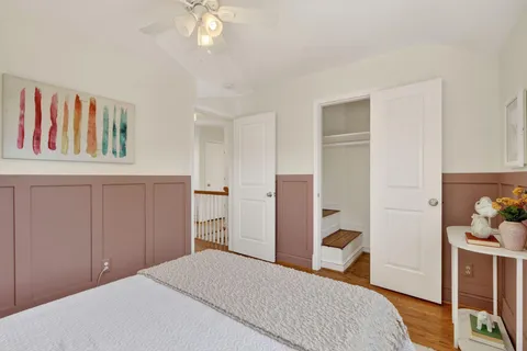 a bedroom with a bed and a cabinets