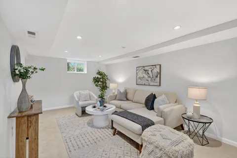 a bathroom with a toilet a sink and a mirror
