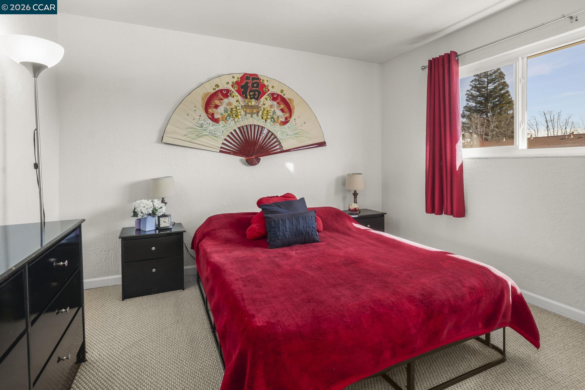61 Meadowbrook Circle Pittsburg, CA 94565 - Photo 16 of 24 a large bed sitting in a bedroom next to a window