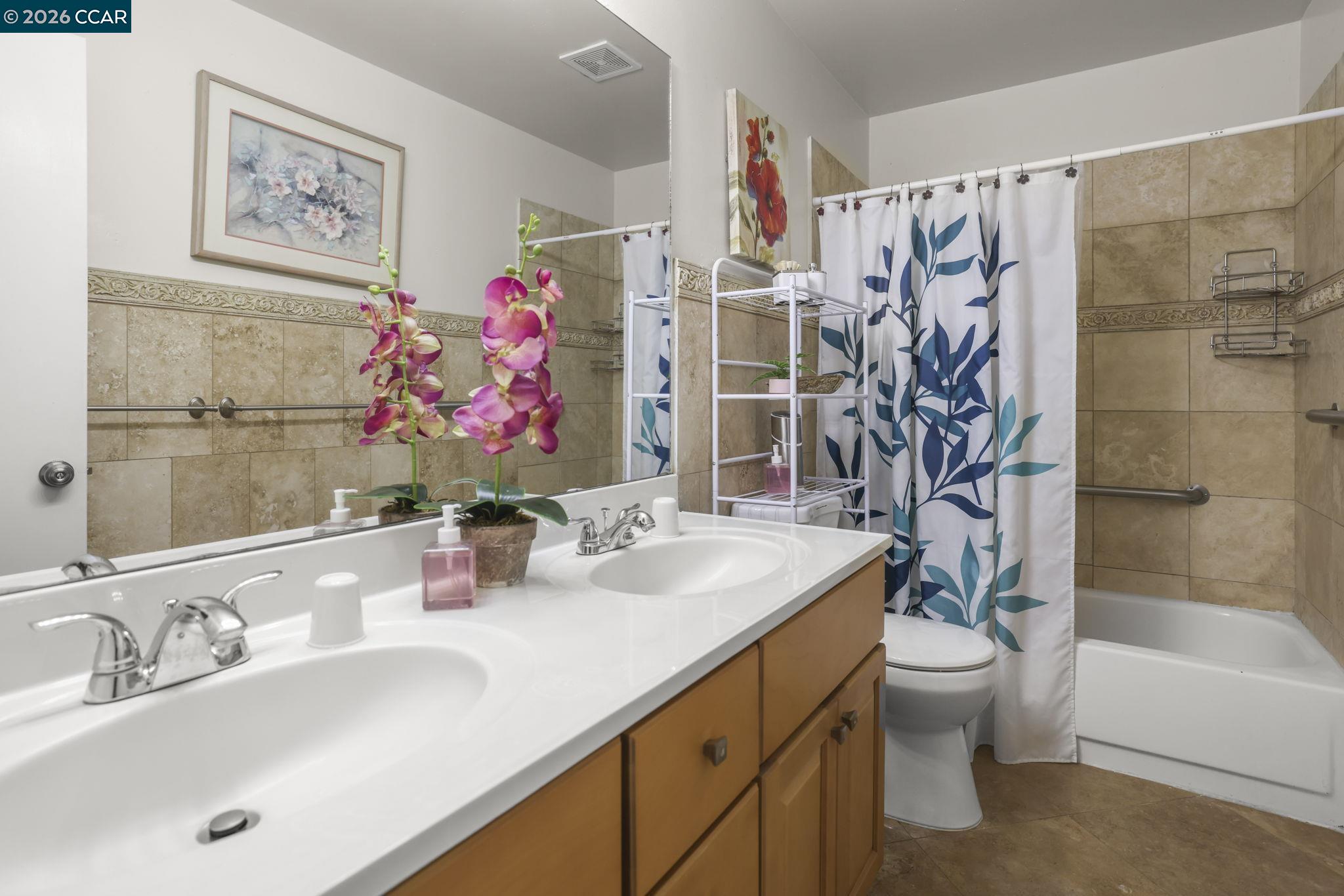 61 Meadowbrook Circle Pittsburg, CA 94565 - Photo 19 of 24 a bathroom with a sink a toilet and shower