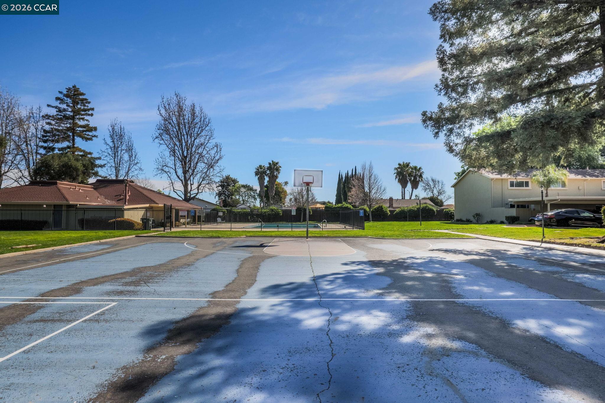 61 Meadowbrook Circle Pittsburg, CA 94565 - Photo 22 of 24 a view of a swimming pool and a yard