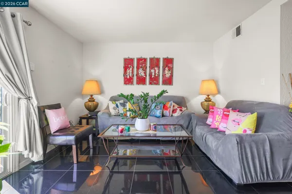 a living room with furniture and a table