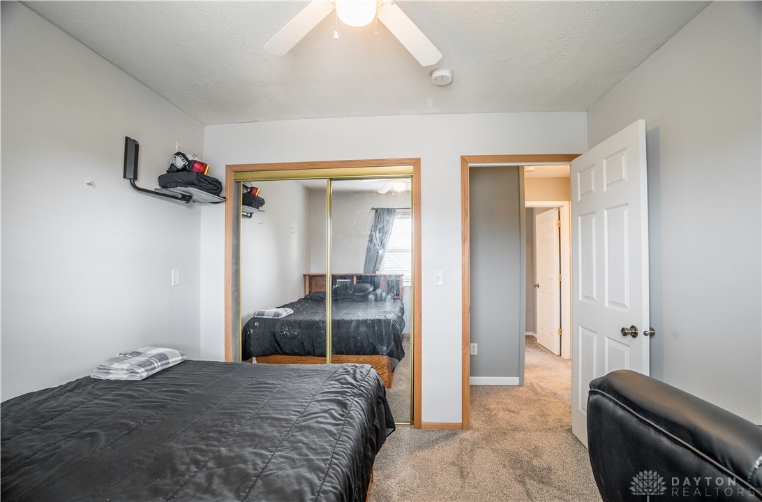 1442 Langdon Road Sidney, OH 45365 - Photo 28 of 34 This spacious bedroom offers ample natural light and a practical layout for comfortable living.