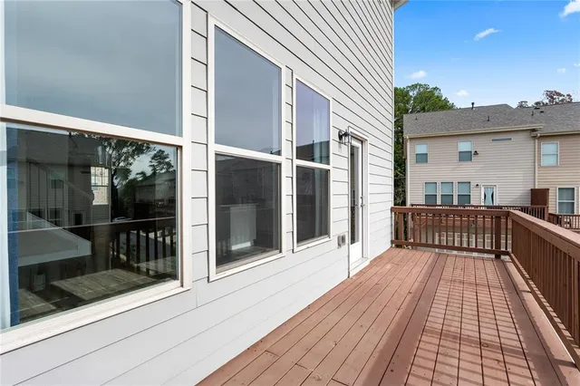 a kitchen with stainless steel appliances granite countertop a sink and a refrigerator