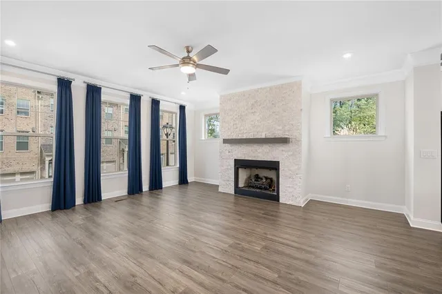 a living room with a fireplace and a fireplace