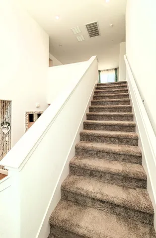 a view of a big room with closet and windows