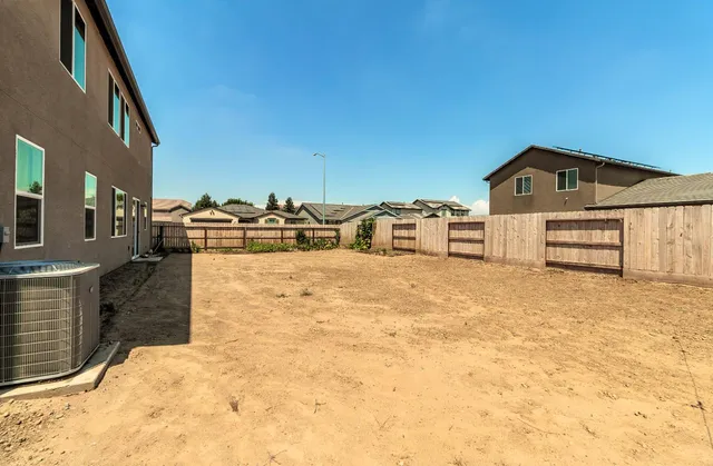 a house view with a backyard