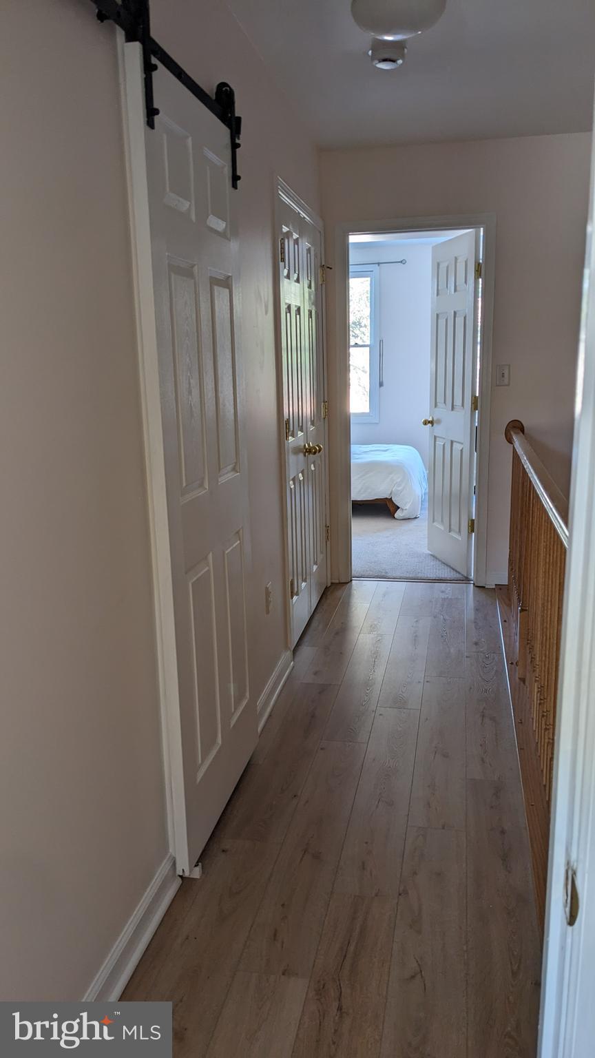 22 West 7th Street Frederick, MD 21701 - Photo 7 of 12 a view of a hallway view with wooden floor and staircase