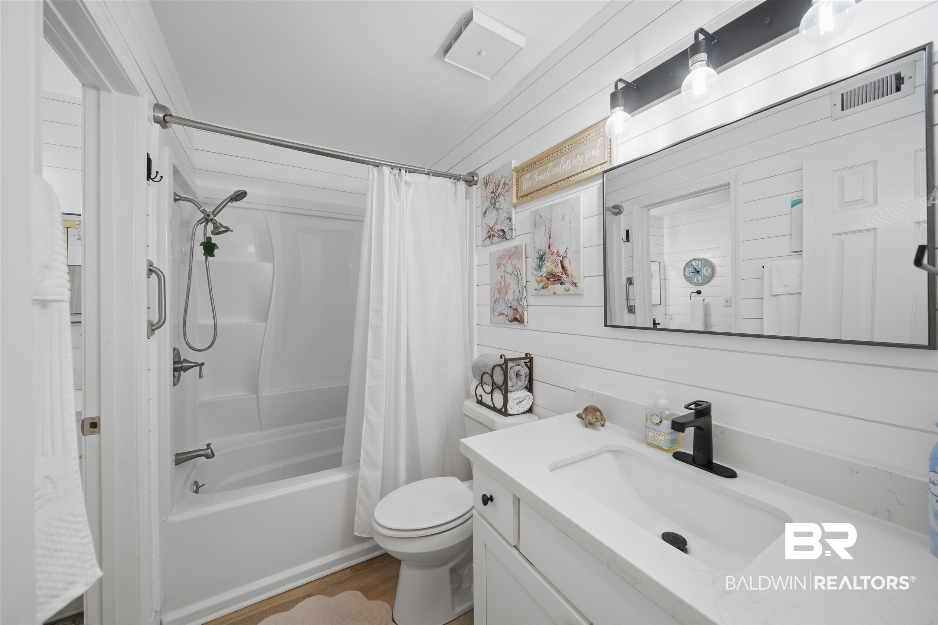 389 Clubhouse Drive, Unit 5H Gulf Shores, AL 36542 - Photo 20 of 43 1st floor bath with additional vanity, toilet and newer shower.