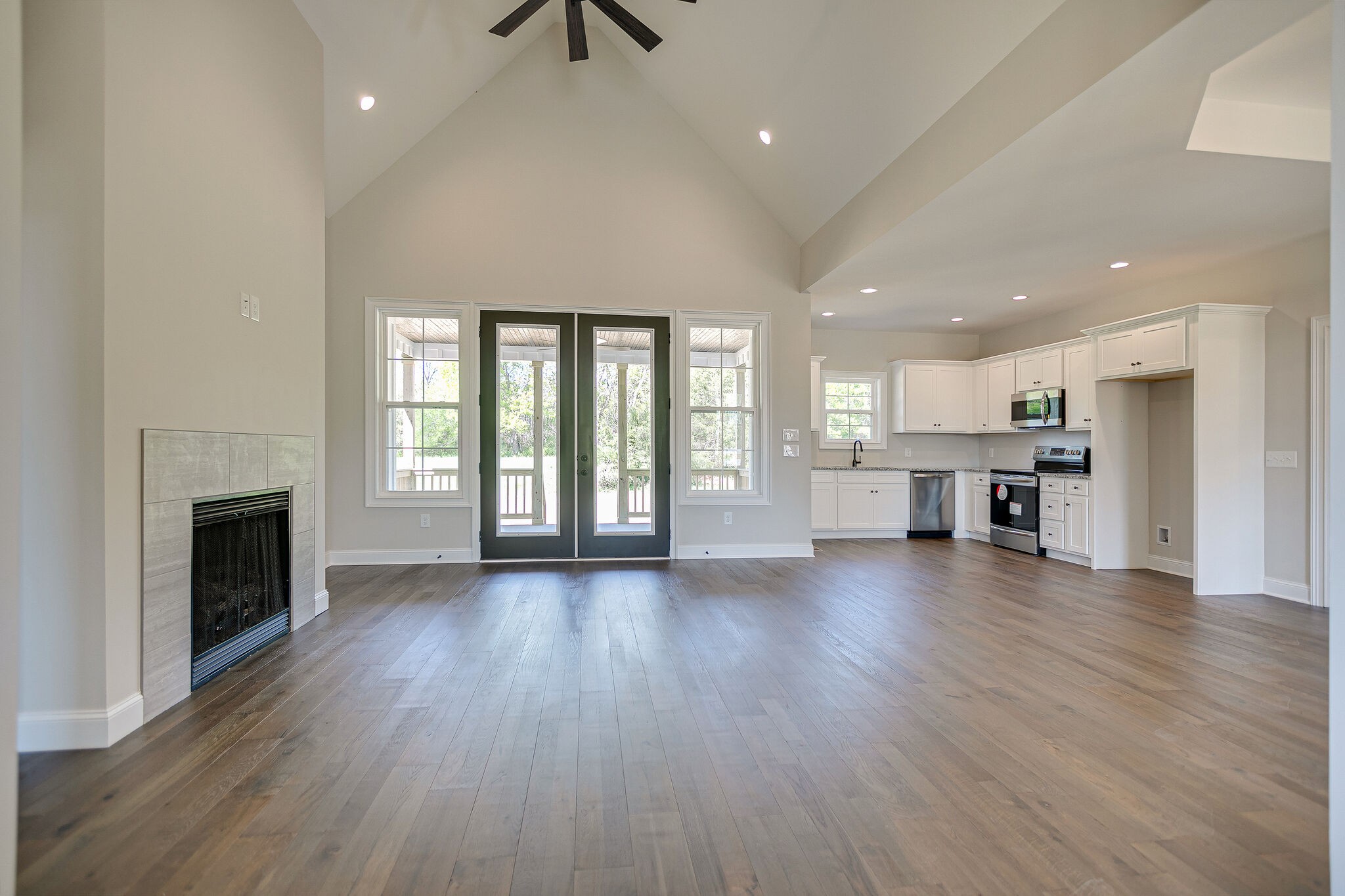 4640 Lunns Store Road Chapel Hill, TN 37034 - Photo 6 of 30 a view of an empty room with wooden floor and a fireplace