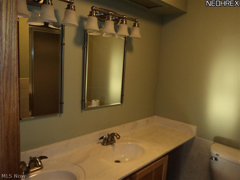 5690 Beach Road Medina, OH 44256 - Photo 12 of 14 MAIN BATH COMPLETELY REDONE WITH CULTURED MARBLE COUNTERS AND INSERT.