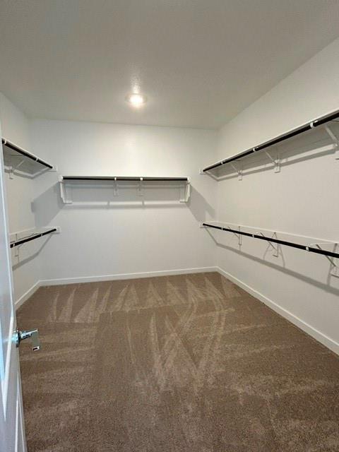 1833 Welsh Road Celina, TX 75009 - Photo 5 of 8 Spacious walk-in closet featuring white walls, recessed lighting, and expansive shelving with integrated hanging rods