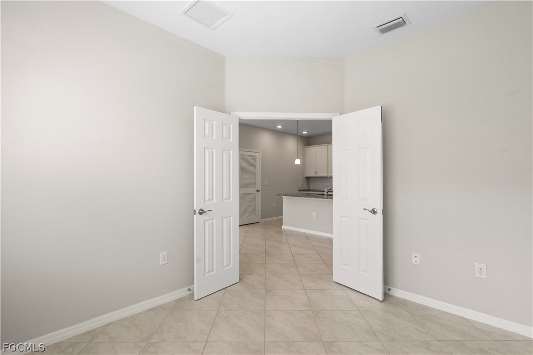 4443 Dutchess Park Road Fort Myers, FL 33916 - Photo 12 of 19 an empty room with a bathroom and a sink