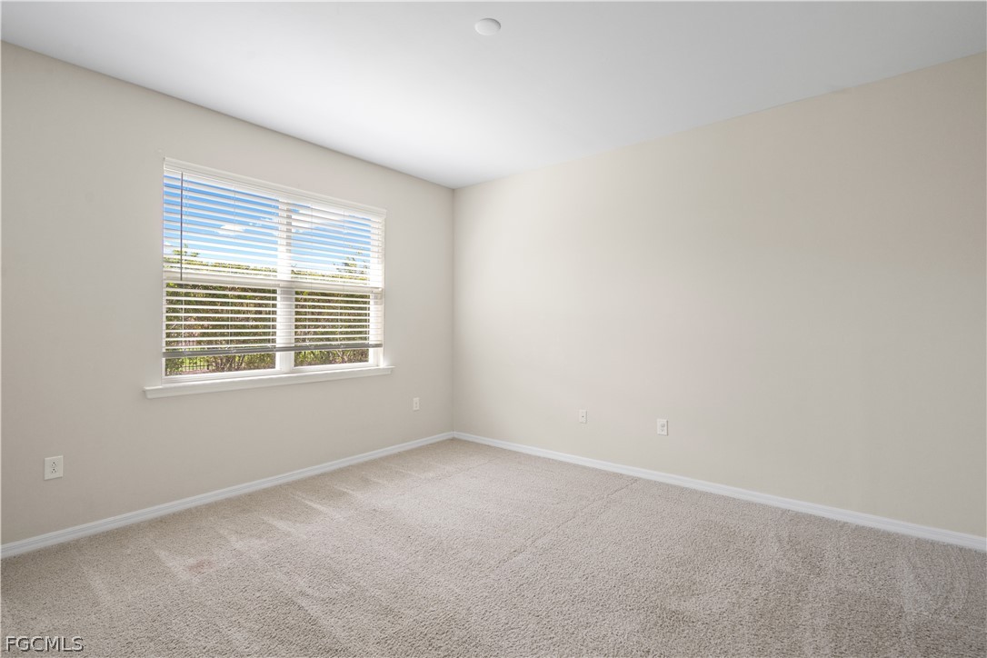 4443 Dutchess Park Road Fort Myers, FL 33916 - Photo 17 of 19 a view of an empty room with a window