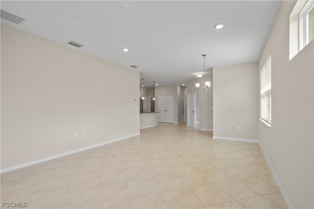 4443 Dutchess Park Road Fort Myers, FL 33916 - Photo 5 of 19 a view of a big room with a kitchen and windows