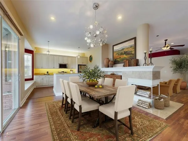 a kitchen with stainless steel appliances granite countertop a refrigerator sink and stove
