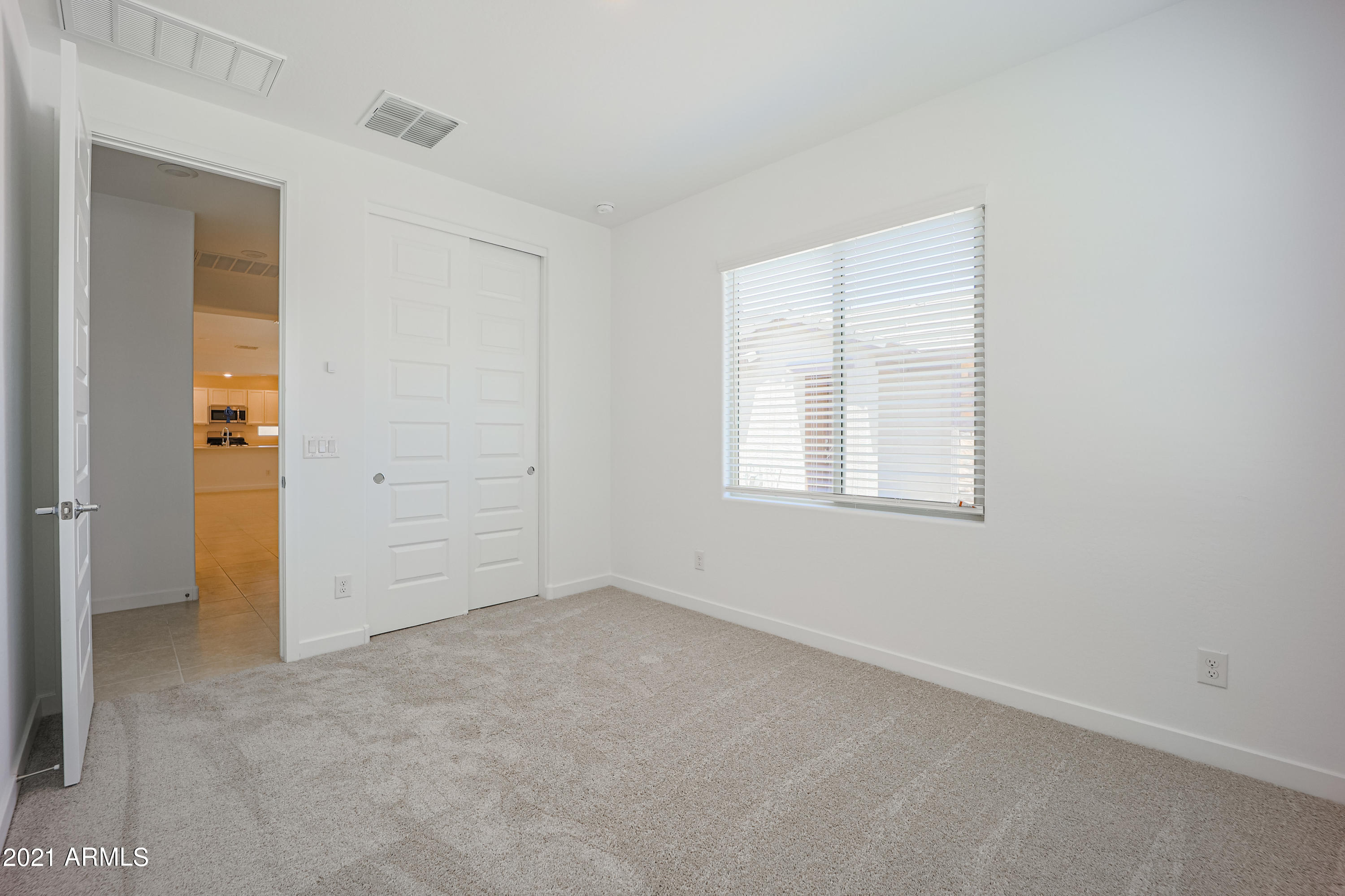 16556 West Alameda Road Surprise, AZ 85387 - Photo 17 of 34 an empty room with windows