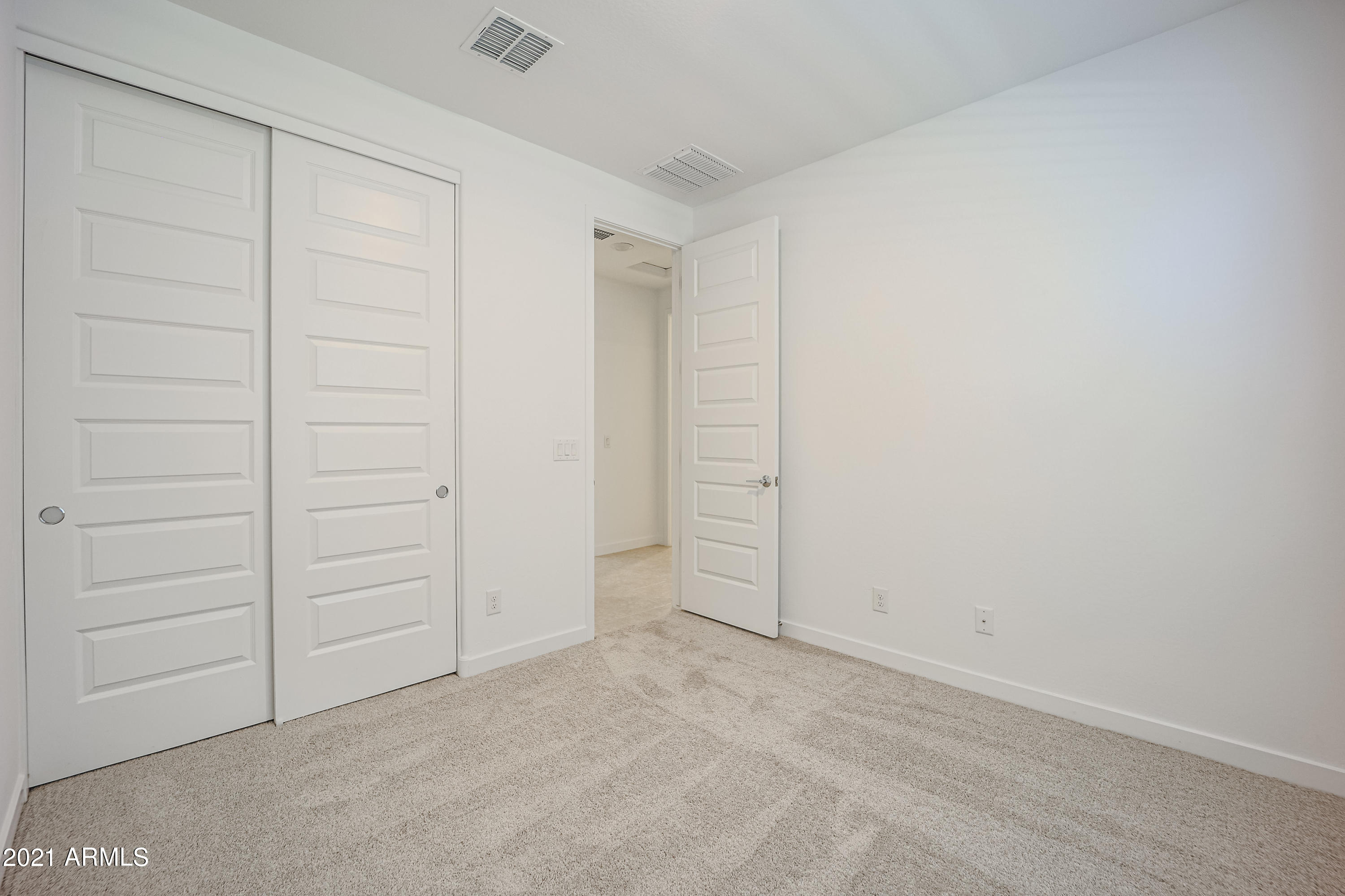 16556 West Alameda Road Surprise, AZ 85387 - Photo 22 of 34 an empty room with closet
