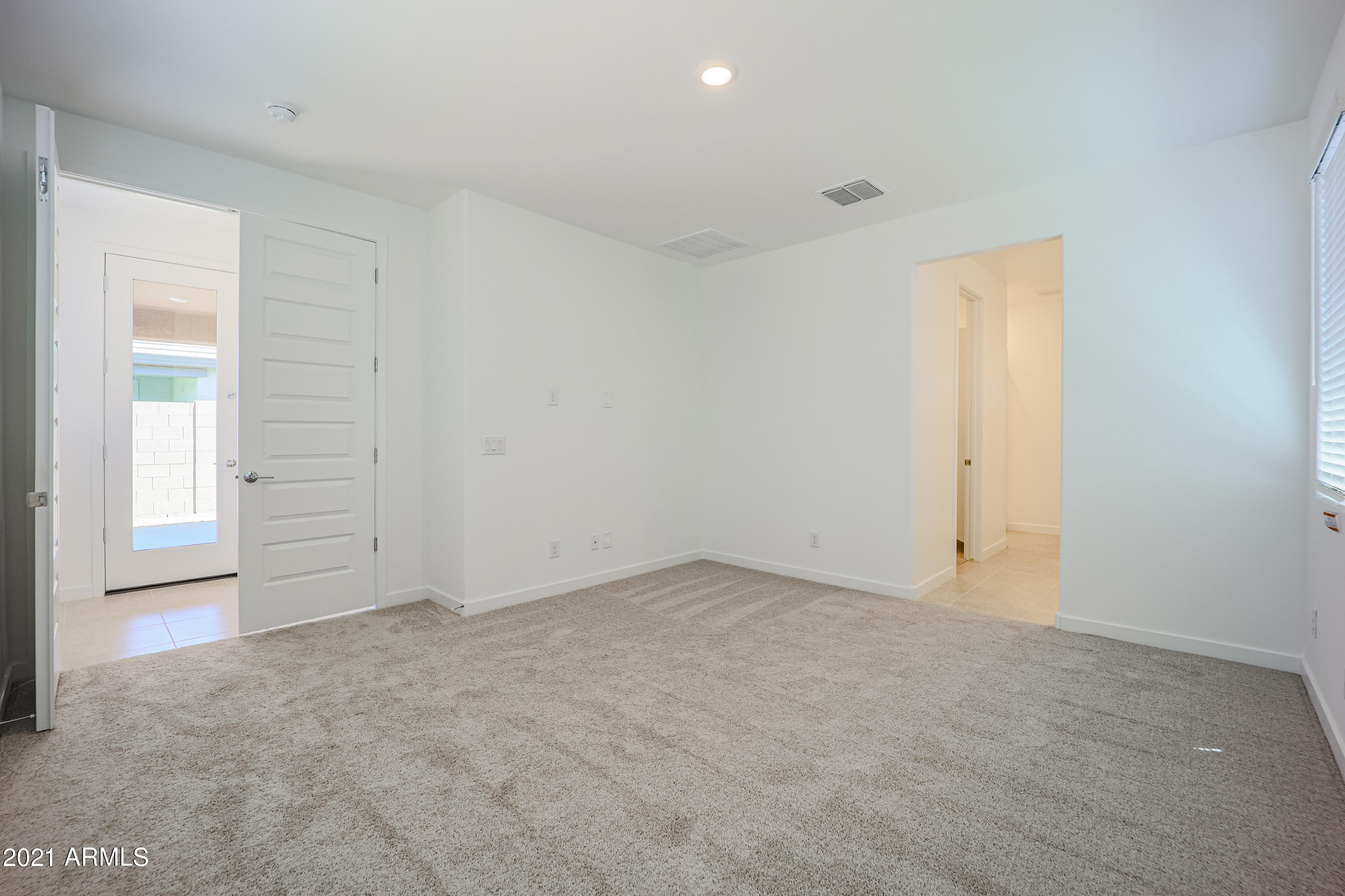 16556 West Alameda Road Surprise, AZ 85387 - Photo 26 of 34 an empty room with windows