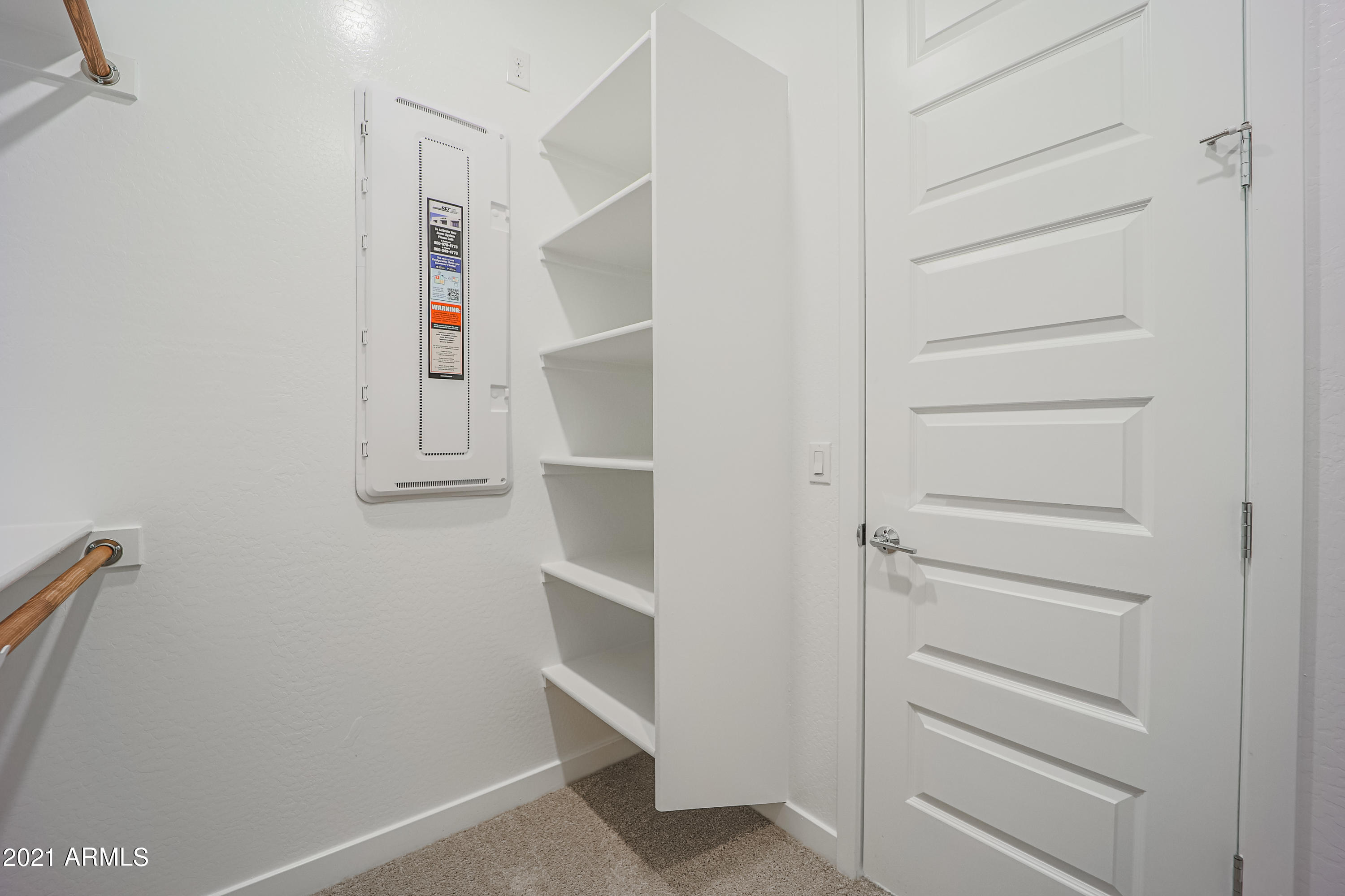 16556 West Alameda Road Surprise, AZ 85387 - Photo 31 of 34 a view of walk in closet with empty racks