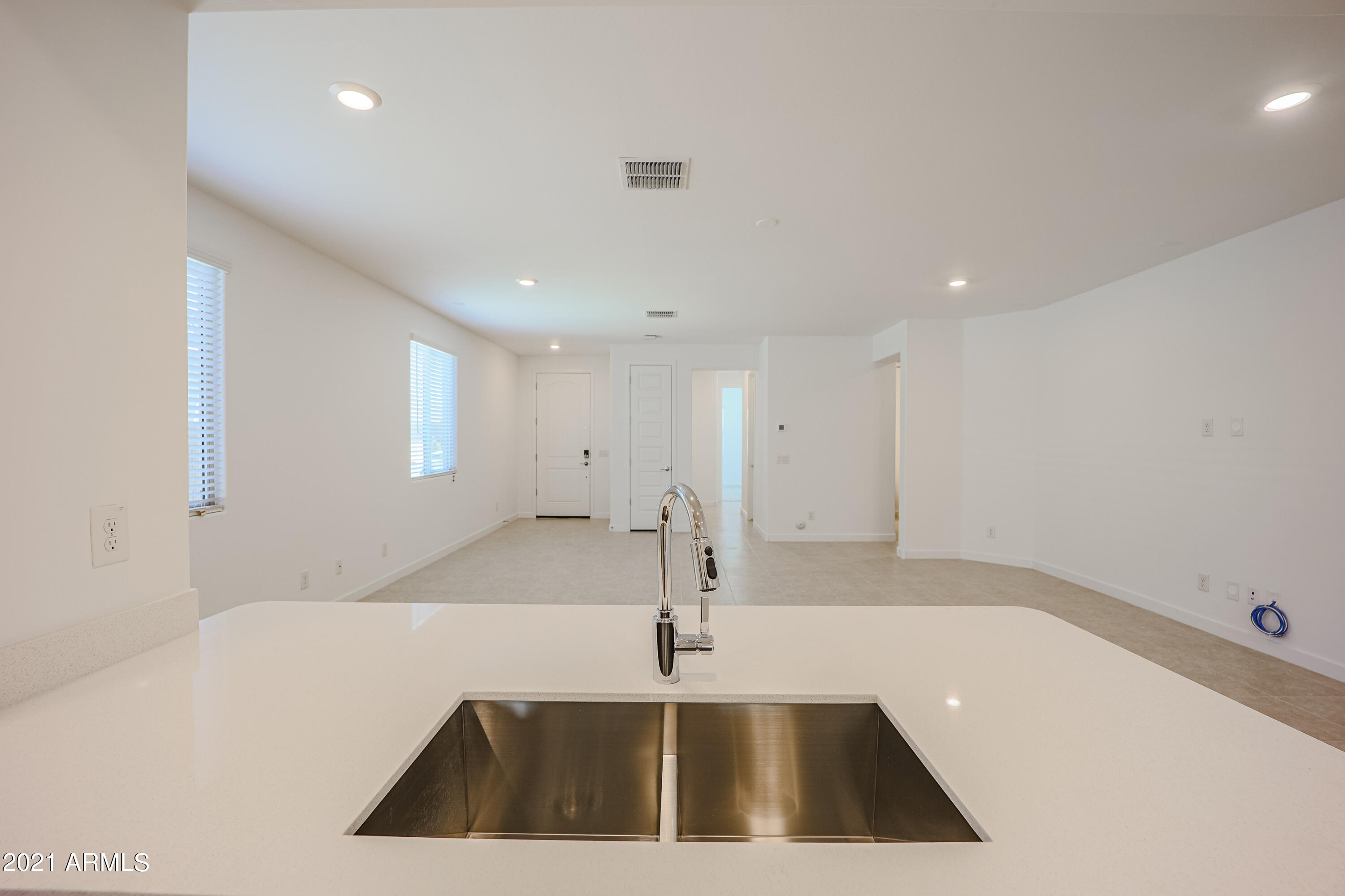 16556 West Alameda Road Surprise, AZ 85387 - Photo 10 of 34 a view of a kitchen with a sink and dishwasher
