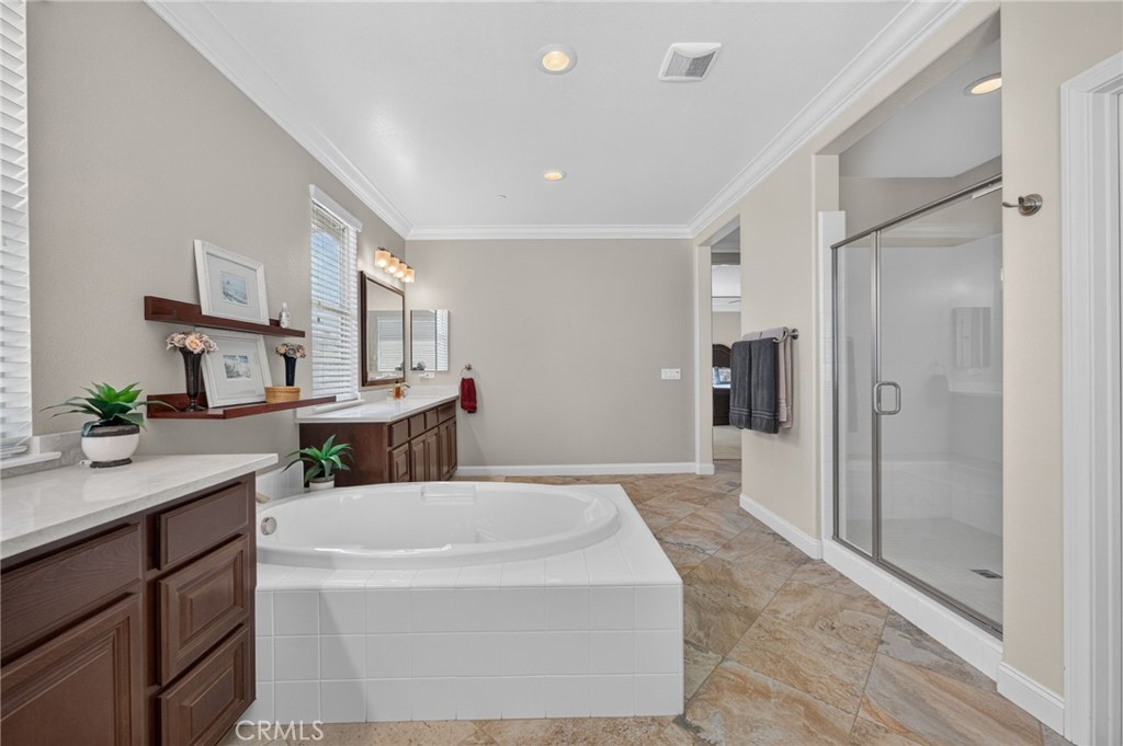31749 Country View Road Temecula, CA 92591 - Photo 37 of 68 a kitchen with stainless steel appliances kitchen island granite countertop a refrigerator and a sink