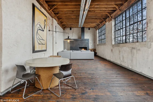 a room with a table and chairs