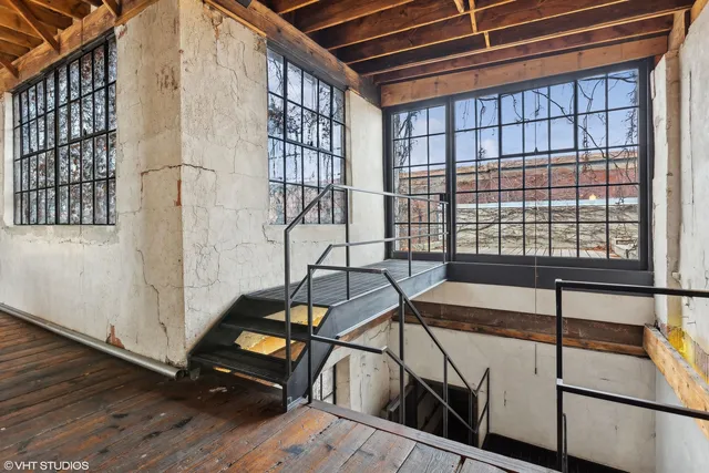 a dining room with furniture and a chandelier