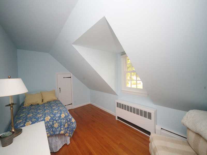 42 Walmsley Road Darien, CT 06820 - Photo 12 of 21 a bedroom with a bed and a window