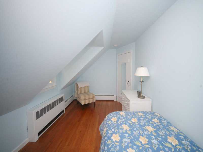42 Walmsley Road Darien, CT 06820 - Photo 13 of 21 a bedroom with a bed and a lamp on table