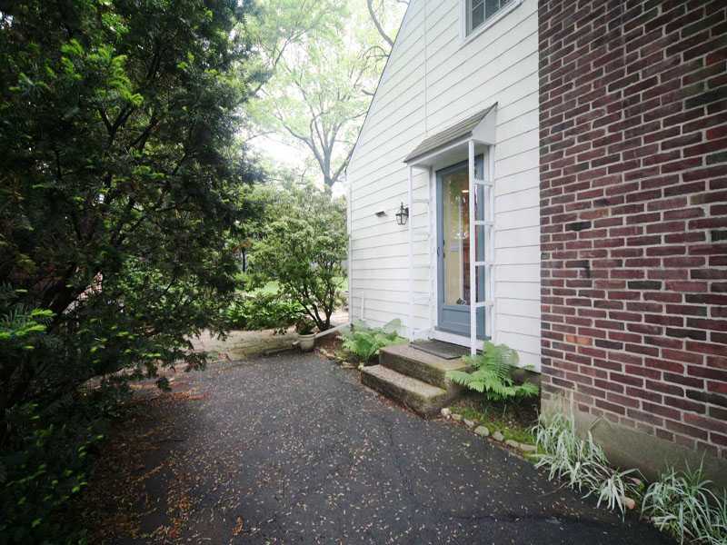 42 Walmsley Road Darien, CT 06820 - Photo 18 of 21 a view of a house with a street