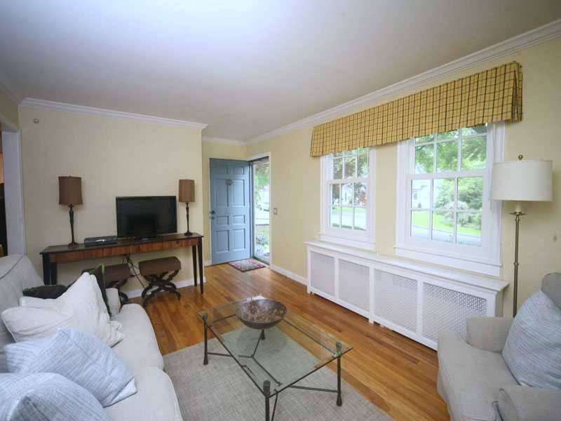 42 Walmsley Road Darien, CT 06820 - Photo 4 of 21 a living room with furniture and a flat screen tv
