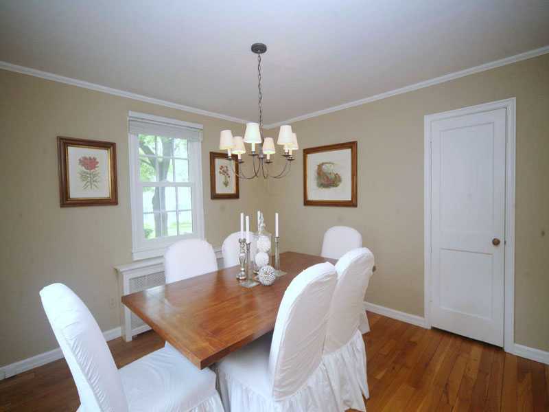 42 Walmsley Road Darien, CT 06820 - Photo 6 of 21 a view of a dining room with furniture wooden floor and chandelier