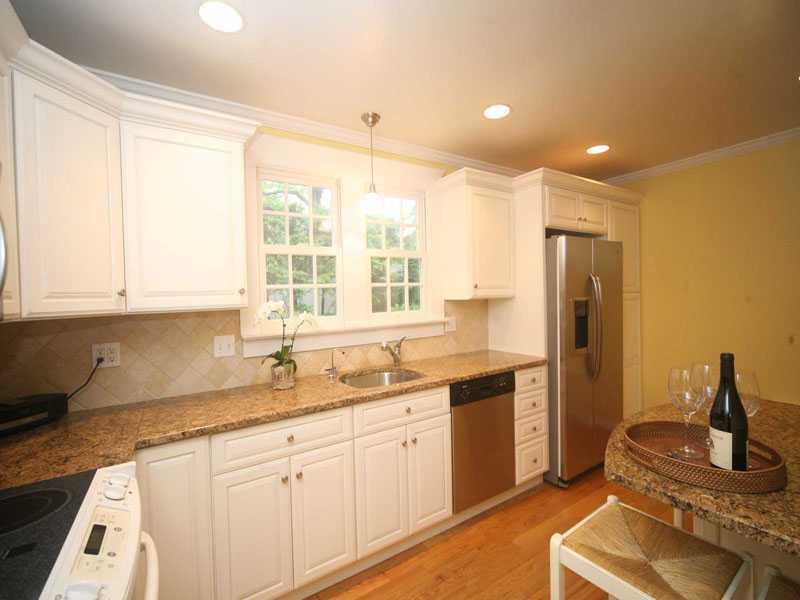 42 Walmsley Road Darien, CT 06820 - Photo 7 of 21 a kitchen with a sink stove and cabinets
