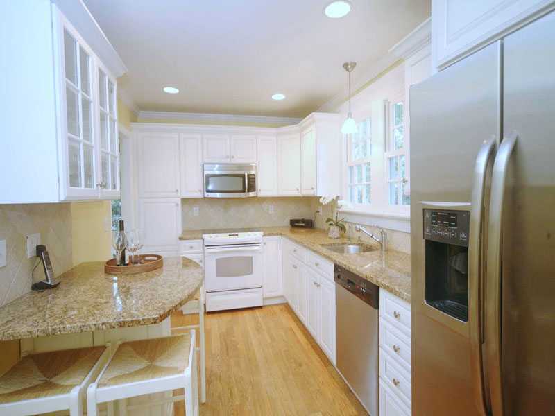42 Walmsley Road Darien, CT 06820 - Photo 8 of 21 a kitchen with stainless steel appliances granite countertop a sink refrigerator and cabinets