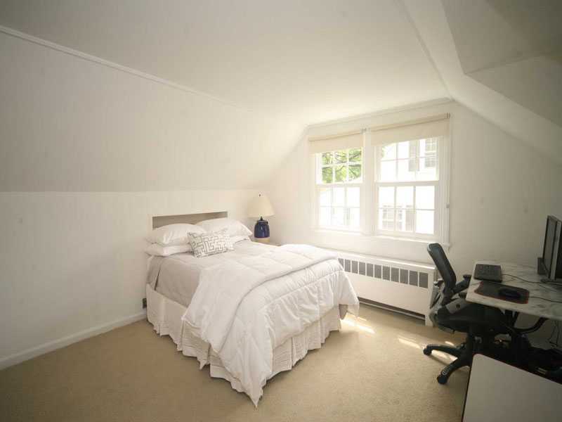 42 Walmsley Road Darien, CT 06820 - Photo 10 of 21 a bedroom with a bed and a window