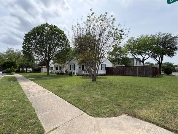 a view of wooden floor and windows in a room