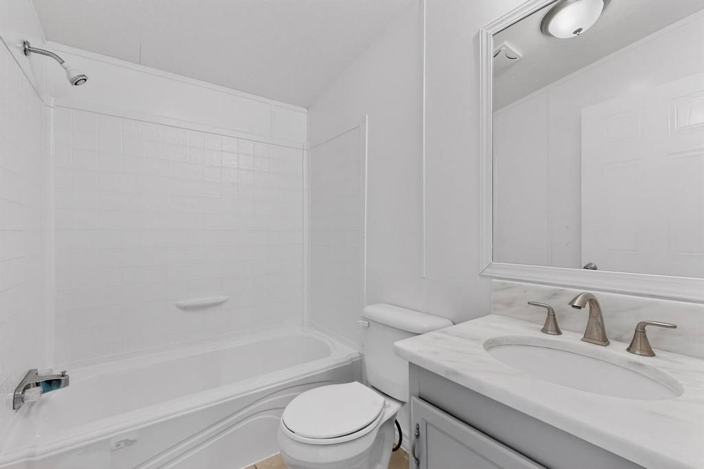 6553 Private Road 2270 Quinlan, TX 75474 - Photo 11 of 31 Bathroom with vanity and shower combination