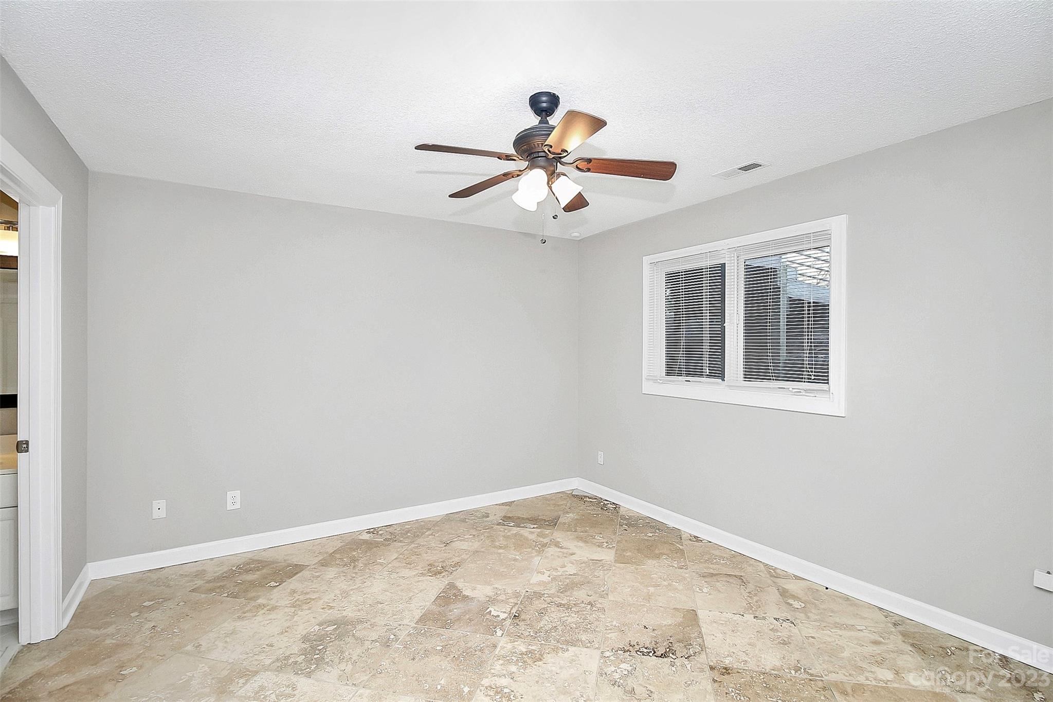 13932 Queens Harbor Road Charlotte, NC 28278 - Photo 13 of 42 a view of an empty room with a window