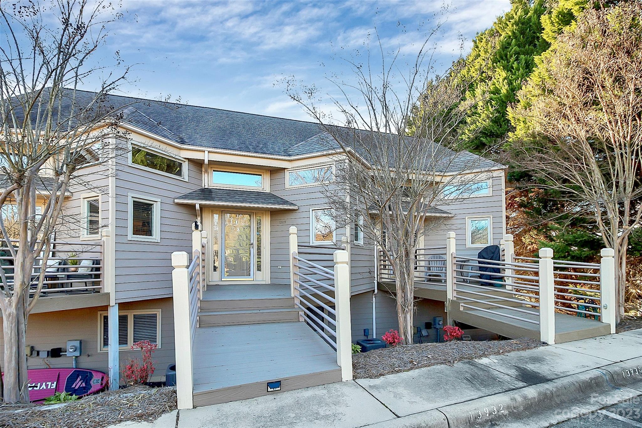 13932 Queens Harbor Road Charlotte, NC 28278 - Photo 2 of 42 a view of a house with a garage