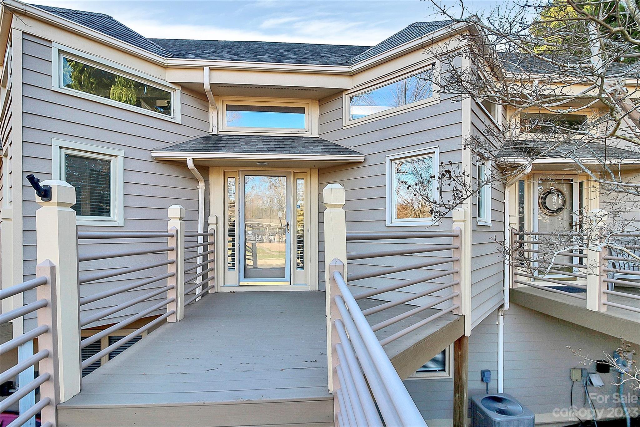 13932 Queens Harbor Road Charlotte, NC 28278 - Photo 3 of 42 a view of a patio with a table and chairs