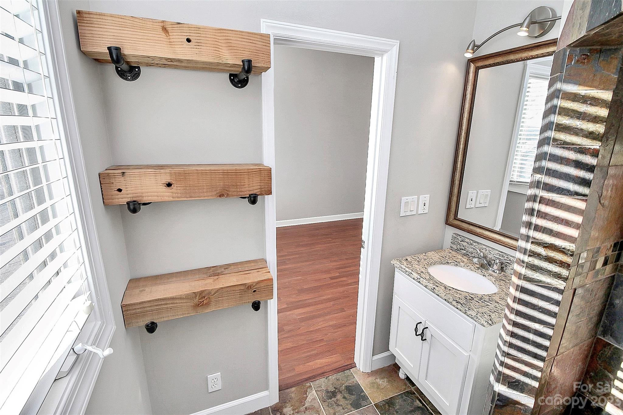 13932 Queens Harbor Road Charlotte, NC 28278 - Photo 31 of 42 a bathroom with a granite countertop sink