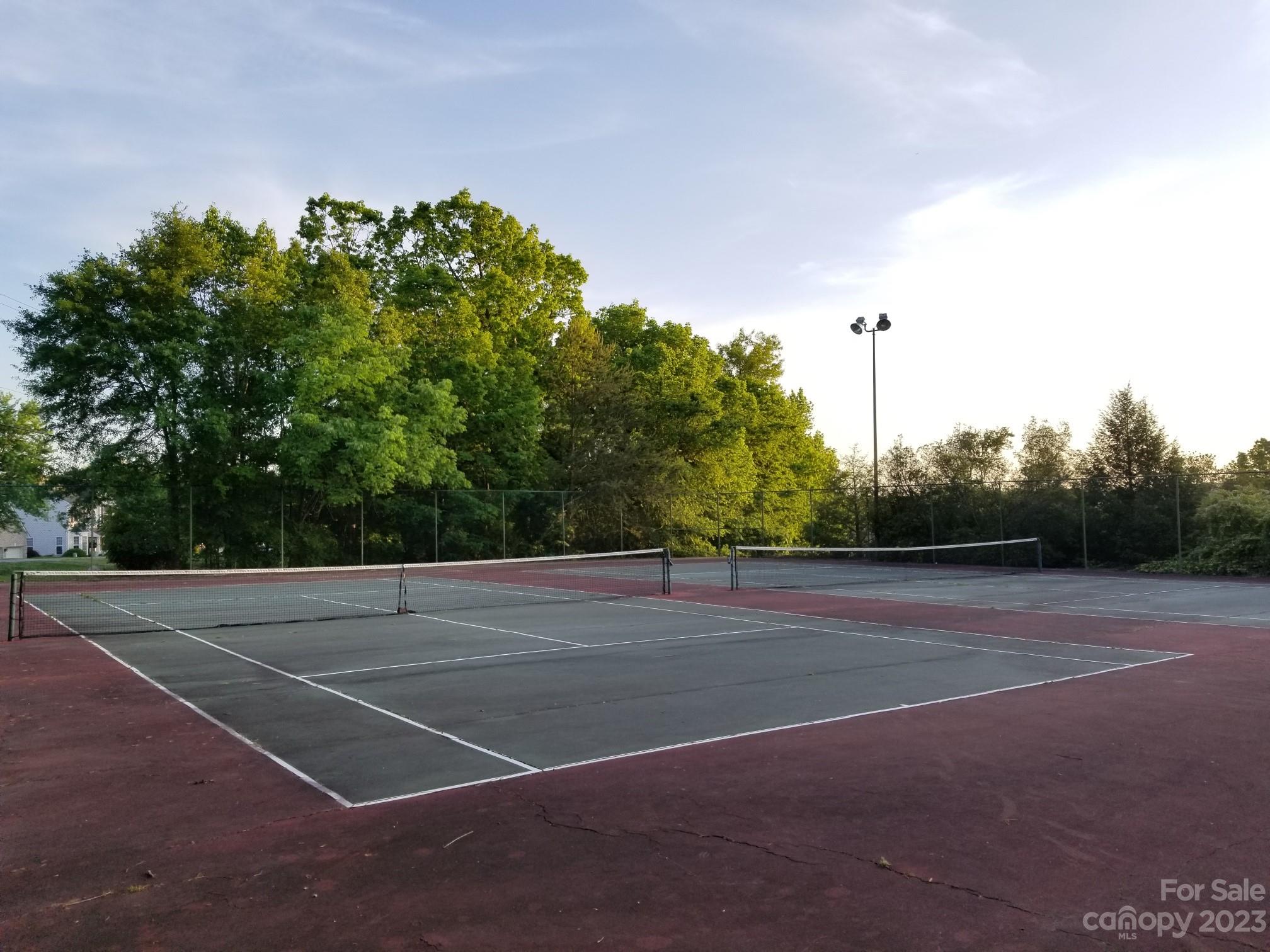 13932 Queens Harbor Road Charlotte, NC 28278 - Photo 40 of 42 a view of a tennis court
