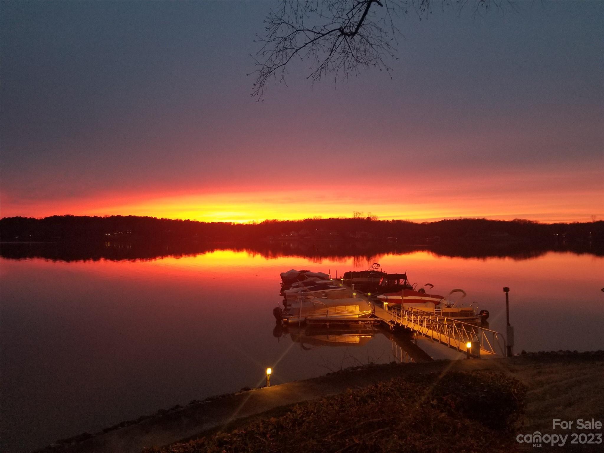13932 Queens Harbor Road Charlotte, NC 28278 - Photo 42 of 42 a sunset view with a lake
